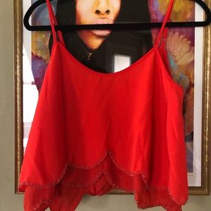 Red cropped tank top with beaded hemline
